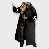 Κομψό Μακρύ Παλτό με Μοντέρνες Λεπτομέρειες